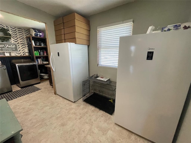 513 E Monroe St, Maud, OK 74854 - kitchen with freestanding refrigerator, washer / dryer, and refrigerator