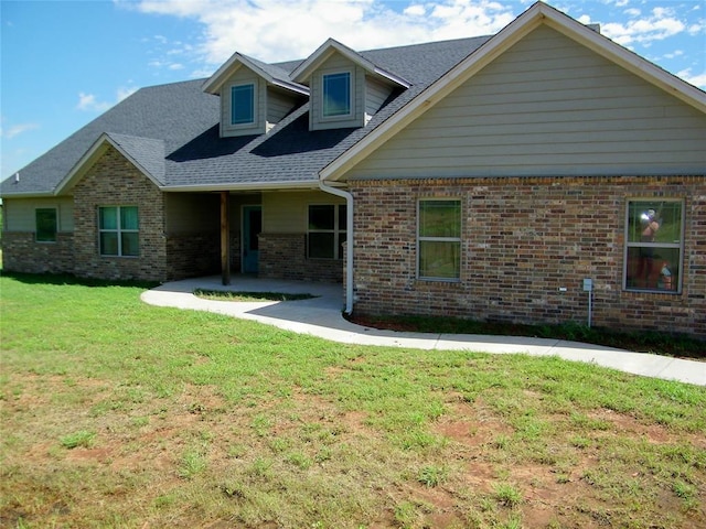 25183 E 840th Rd, Kingfisher, OK 73750 - view of front of house featuring brick siding, a patio, and a front yard