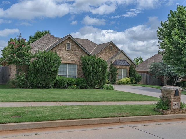 421 Meadow Run Ct, Yukon, OK 73099 - view of front facade featuring brick siding, concrete driveway, and roof with shingles