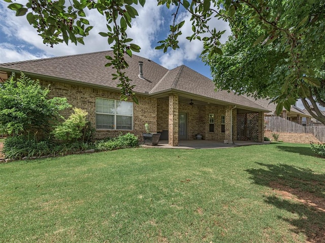 421 Meadow Run Ct, Yukon, OK 73099 - back of house featuring ceiling fan, a shingled roof, a patio, and brick siding