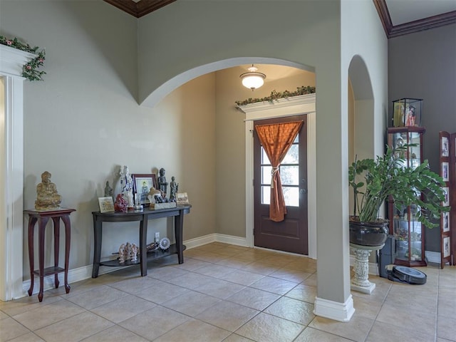 421 Meadow Run Ct, Yukon, OK 73099 - tiled entrance foyer with ornamental molding, arched walkways, and baseboards
