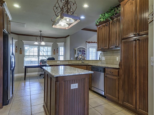 421 Meadow Run Ct, Yukon, OK 73099 - kitchen featuring dishwasher, a sink, a chandelier, backsplash, and light tile patterned flooring
