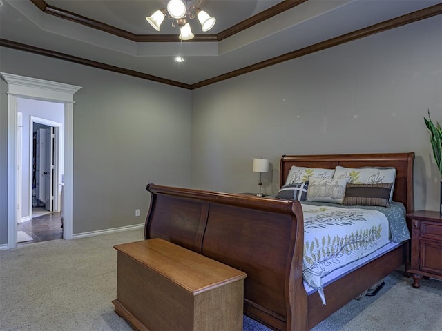 421 Meadow Run Ct, Yukon, OK 73099 - bedroom featuring a raised ceiling, carpet floors, crown molding, and baseboards