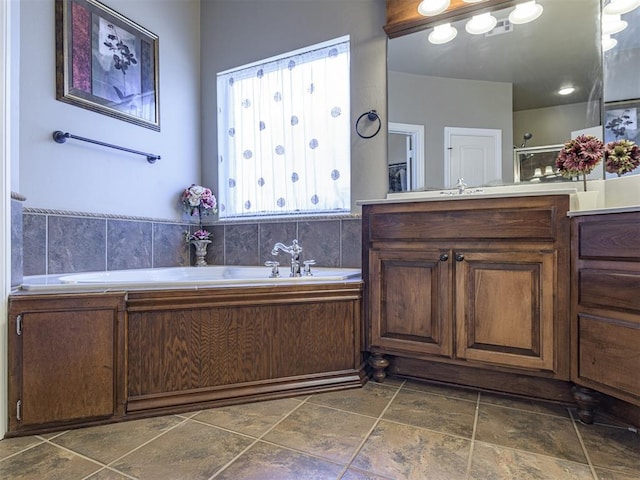 421 Meadow Run Ct, Yukon, OK 73099 - bathroom featuring stone tile flooring, vanity, a garden tub, and a shower with shower door