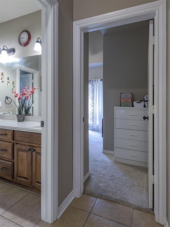 421 Meadow Run Ct, Yukon, OK 73099 - bathroom featuring vanity, tile patterned floors, and baseboards