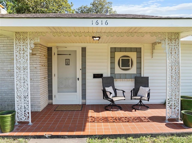1616 SW 6th Ave, Ardmore, OK 73401 - doorway to property with a porch and brick siding