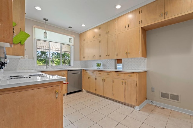 1616 SW 6th Ave, Ardmore, OK 73401 - kitchen with stainless steel dishwasher, light countertops, decorative backsplash, light tile patterned floors, and decorative light fixtures
