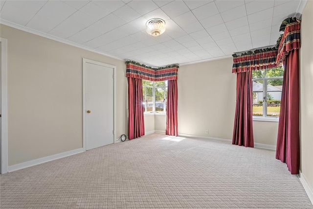 1616 SW 6th Ave, Ardmore, OK 73401 - spare room with carpet, crown molding, and baseboards