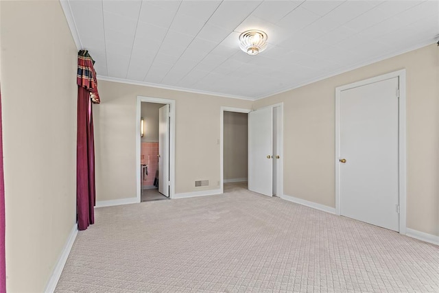 1616 SW 6th Ave, Ardmore, OK 73401 - unfurnished bedroom featuring carpet floors, ornamental molding, baseboards, and ensuite bathroom
