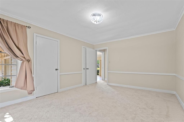1616 SW 6th Ave, Ardmore, OK 73401 - empty room featuring carpet floors, crown molding, and baseboards