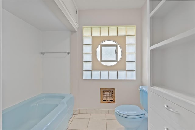 1616 SW 6th Ave, Ardmore, OK 73401 - bathroom with tile patterned floors, toilet, a tub, and heating unit