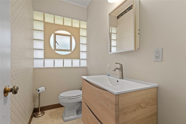 1616 SW 6th Ave, Ardmore, OK 73401 - bathroom featuring vanity, toilet, and baseboards