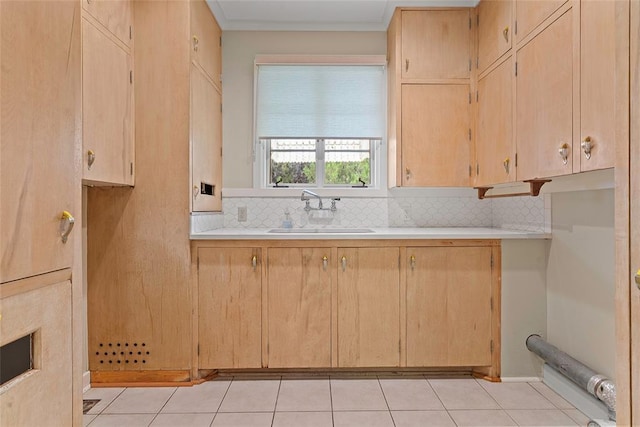 1616 SW 6th Ave, Ardmore, OK 73401 - kitchen with a sink, decorative backsplash, light countertops, and light brown cabinets