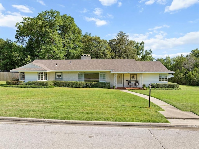 1616 SW 6th Ave, Ardmore, OK 73401 - single story home with a front lawn, covered porch, and a chimney