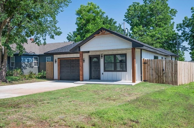 1435 NE 27th St, Oklahoma City, OK 73111 - single story home featuring an attached garage, driveway, board and batten siding, and a shingled roof