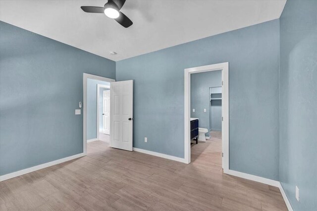 1435 NE 27th St, Oklahoma City, OK 73111 - unfurnished room with a ceiling fan, wood finished floors, and baseboards
