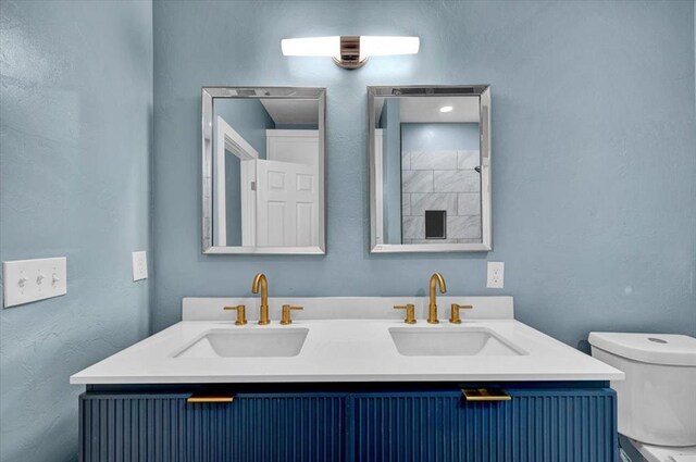 1435 NE 27th St, Oklahoma City, OK 73111 - bathroom with toilet and double vanity