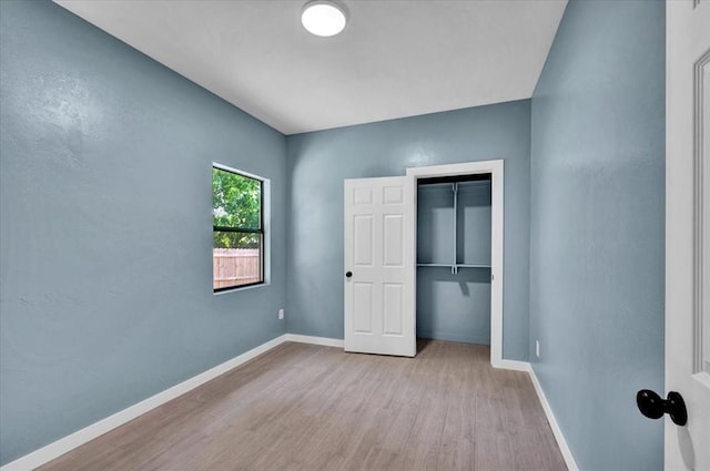 1435 NE 27th St, Oklahoma City, OK 73111 - unfurnished bedroom with wood finished floors, baseboards, and a closet