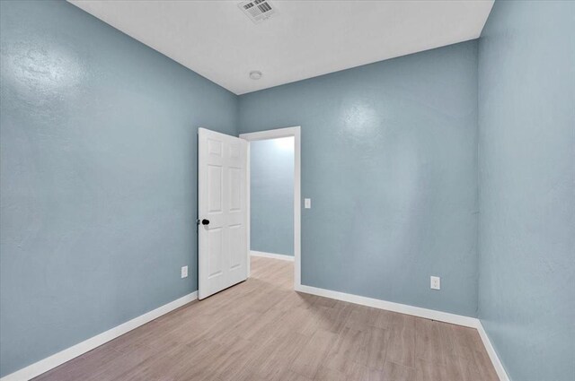 1435 NE 27th St, Oklahoma City, OK 73111 - unfurnished room with baseboards and wood finished floors