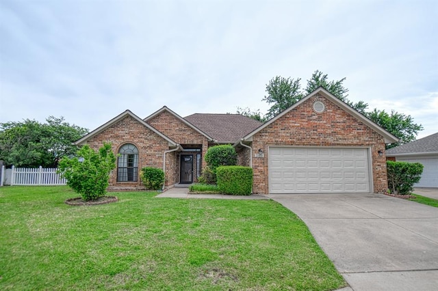 3100 Windward Ct, Norman, OK 73072 - view of front of house featuring a garage, concrete driveway, and brick siding