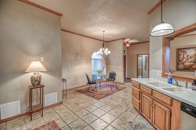 3100 Windward Ct, Norman, OK 73072 - kitchen with a sink, a textured wall, stainless steel dishwasher, crown molding, and a textured ceiling