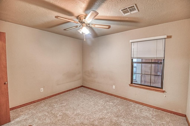3100 Windward Ct, Norman, OK 73072 - carpeted spare room featuring a ceiling fan, baseboards, and a textured ceiling