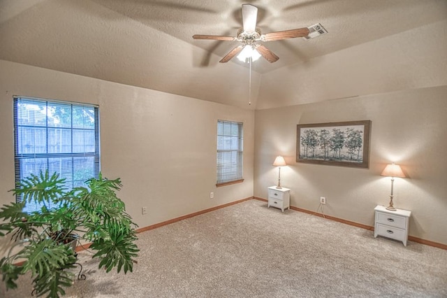 3100 Windward Ct, Norman, OK 73072 - empty room with a ceiling fan, carpet floors, baseboards, a textured ceiling, and lofted ceiling
