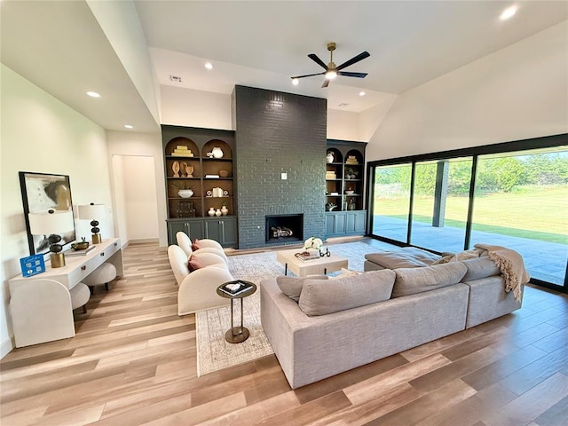 3320 Somerset Farms Rd, Newalla, OK 74857 - living area with a ceiling fan, wood finished floors, plenty of natural light, a brick fireplace, and recessed lighting