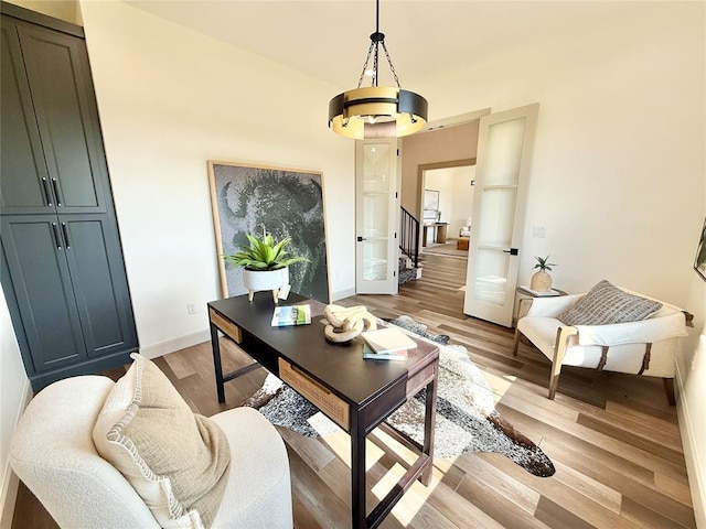 3320 Somerset Farms Rd, Newalla, OK 74857 - office area featuring light wood finished floors, baseboards, and a chandelier