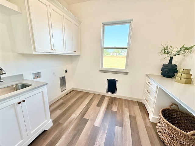 3320 Somerset Farms Rd, Newalla, OK 74857 - washroom with cabinet space, hookup for an electric dryer, hookup for a washing machine, and light wood-type flooring
