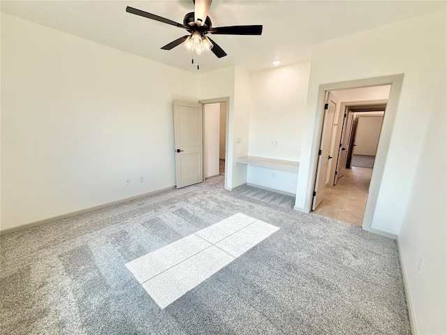 3320 Somerset Farms Rd, Newalla, OK 74857 - unfurnished bedroom with light carpet, baseboards, and ceiling fan