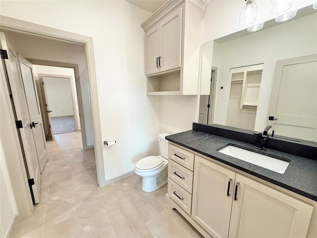 3320 Somerset Farms Rd, Newalla, OK 74857 - bathroom with vanity, toilet, baseboards, and marble look tiles