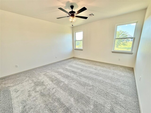 3320 Somerset Farms Rd, Newalla, OK 74857 - carpeted spare room with baseboards and a ceiling fan