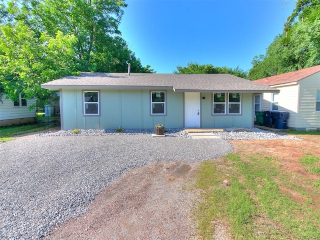 3522 SW 39th St, Oklahoma City, OK 73119 - ranch-style home with a porch, roof with shingles, and board and batten siding