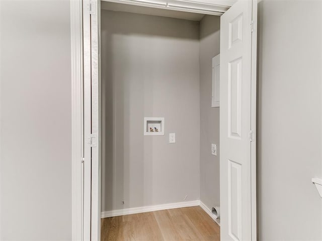 3522 SW 39th St, Oklahoma City, OK 73119 - laundry area featuring washer hookup, light wood-style flooring, and baseboards