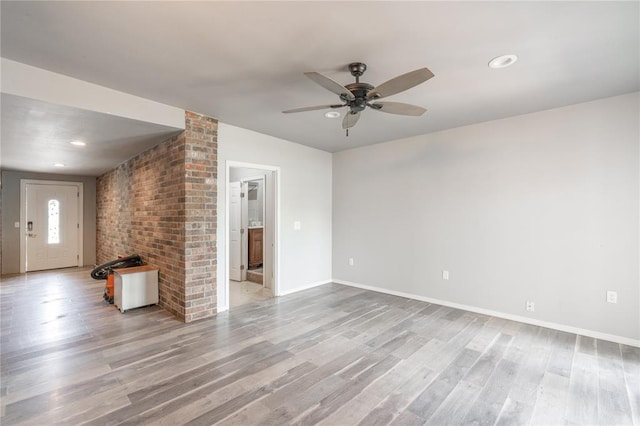 1217 SW 18th St, Oklahoma City, OK 73109 - unfurnished living room with a ceiling fan, light wood finished floors, baseboards, and recessed lighting