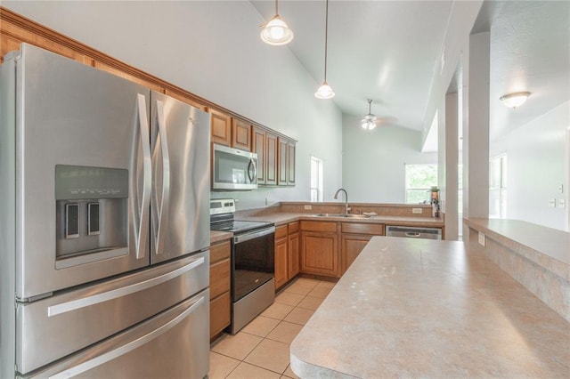 1217 SW 18th St, Oklahoma City, OK 73109 - kitchen featuring appliances with stainless steel finishes, a sink, light tile patterned floors, ceiling fan, and hanging light fixtures