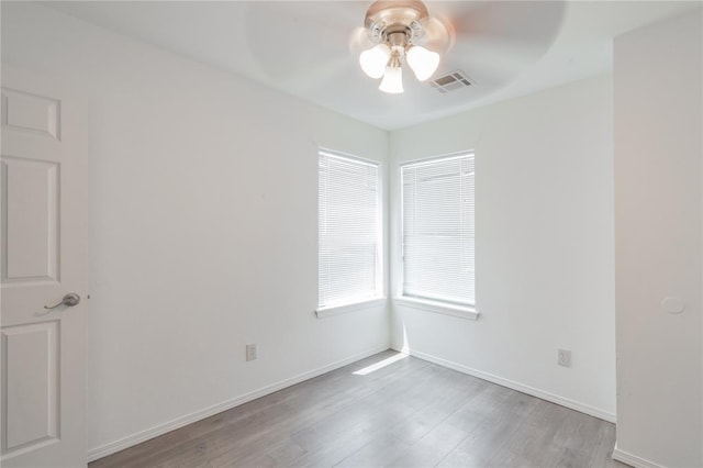 1217 SW 18th St, Oklahoma City, OK 73109 - unfurnished room featuring a ceiling fan, light wood-style flooring, and baseboards