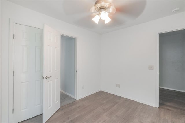 1217 SW 18th St, Oklahoma City, OK 73109 - unfurnished bedroom with light wood-style flooring, baseboards, and ceiling fan