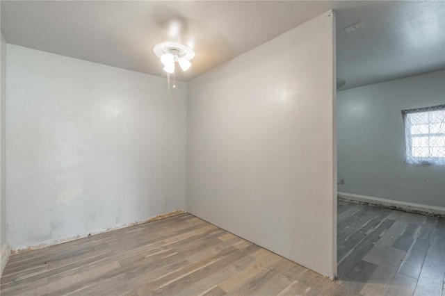 1217 SW 18th St, Oklahoma City, OK 73109 - spare room featuring wood finished floors and ceiling fan