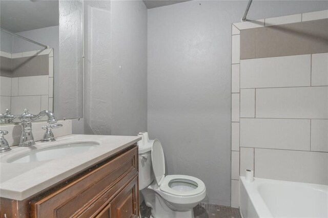 1217 SW 18th St, Oklahoma City, OK 73109 - bathroom featuring toilet, vanity, a textured wall, and shower / bathtub combination