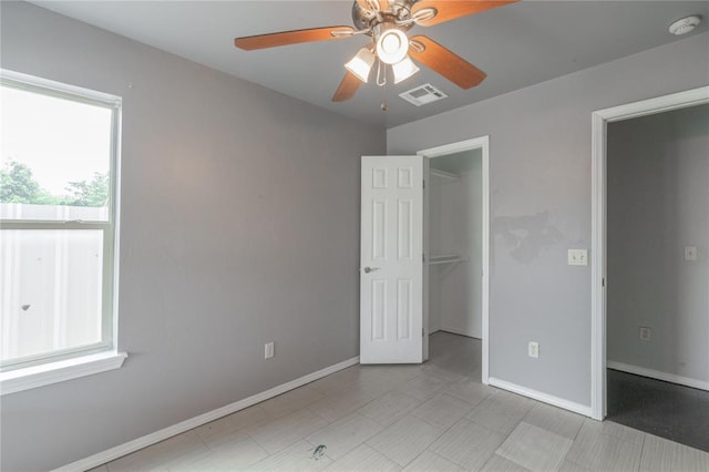 1217 SW 18th St, Oklahoma City, OK 73109 - unfurnished bedroom featuring a spacious closet, baseboards, a closet, and ceiling fan