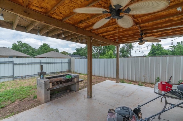 1217 SW 18th St, Oklahoma City, OK 73109 - fenced backyard with a patio area and ceiling fan