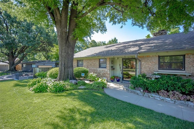 2404 NW 55th Ter, Oklahoma City, OK 73112 - ranch-style home with a front yard, roof with shingles, and a chimney