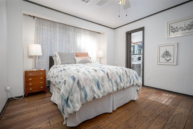 2404 NW 55th Ter, Oklahoma City, OK 73112 - bedroom with hardwood / wood-style floors, baseboards, ensuite bath, and ceiling fan