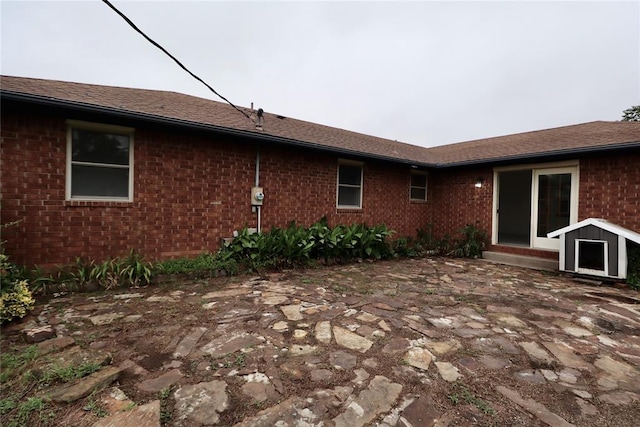 108174 N 3818th Rd, Okemah, OK 74859 - back of property with brick siding and a patio area