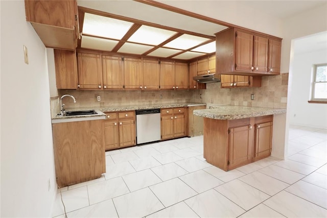 108174 N 3818th Rd, Okemah, OK 74859 - kitchen featuring dishwasher, a sink, backsplash, under cabinet range hood, and brown cabinetry