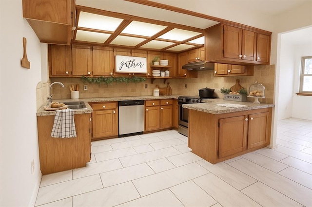 108174 N 3818th Rd, Okemah, OK 74859 - kitchen with stainless steel appliances, a sink, brown cabinetry, decorative backsplash, and light countertops