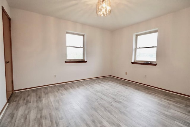 108174 N 3818th Rd, Okemah, OK 74859 - empty room featuring healthy amount of natural light, wood finished floors, and baseboards