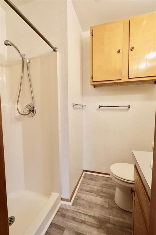 108174 N 3818th Rd, Okemah, OK 74859 - full bath with a shower stall, vanity, wood finished floors, toilet, and baseboards